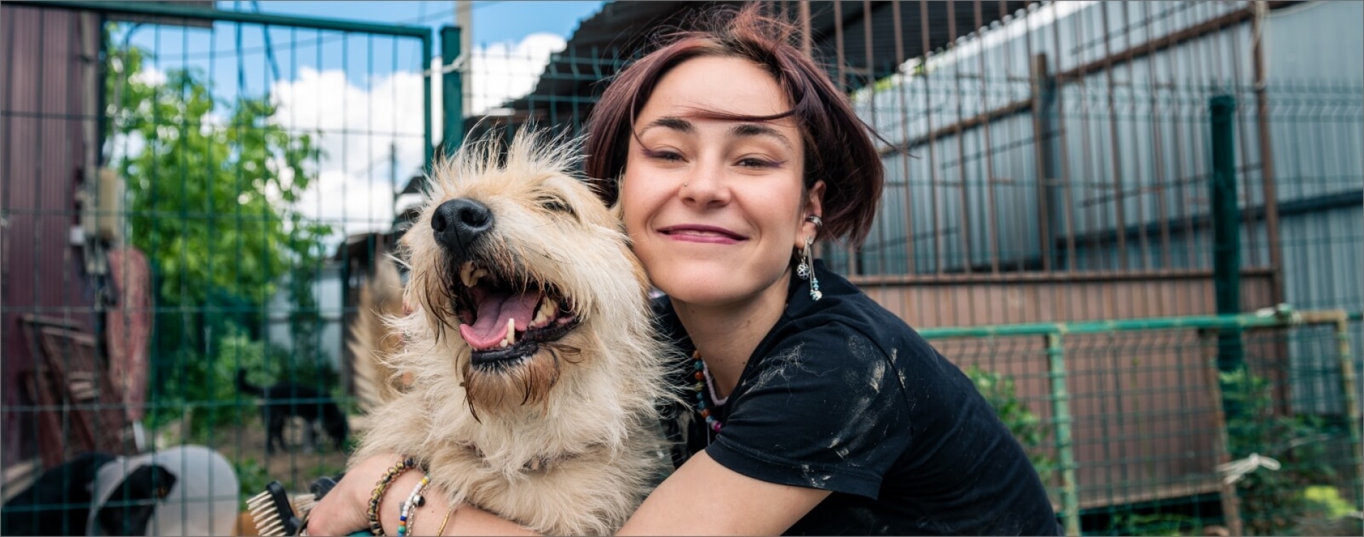 woman and dog smiling at the camera